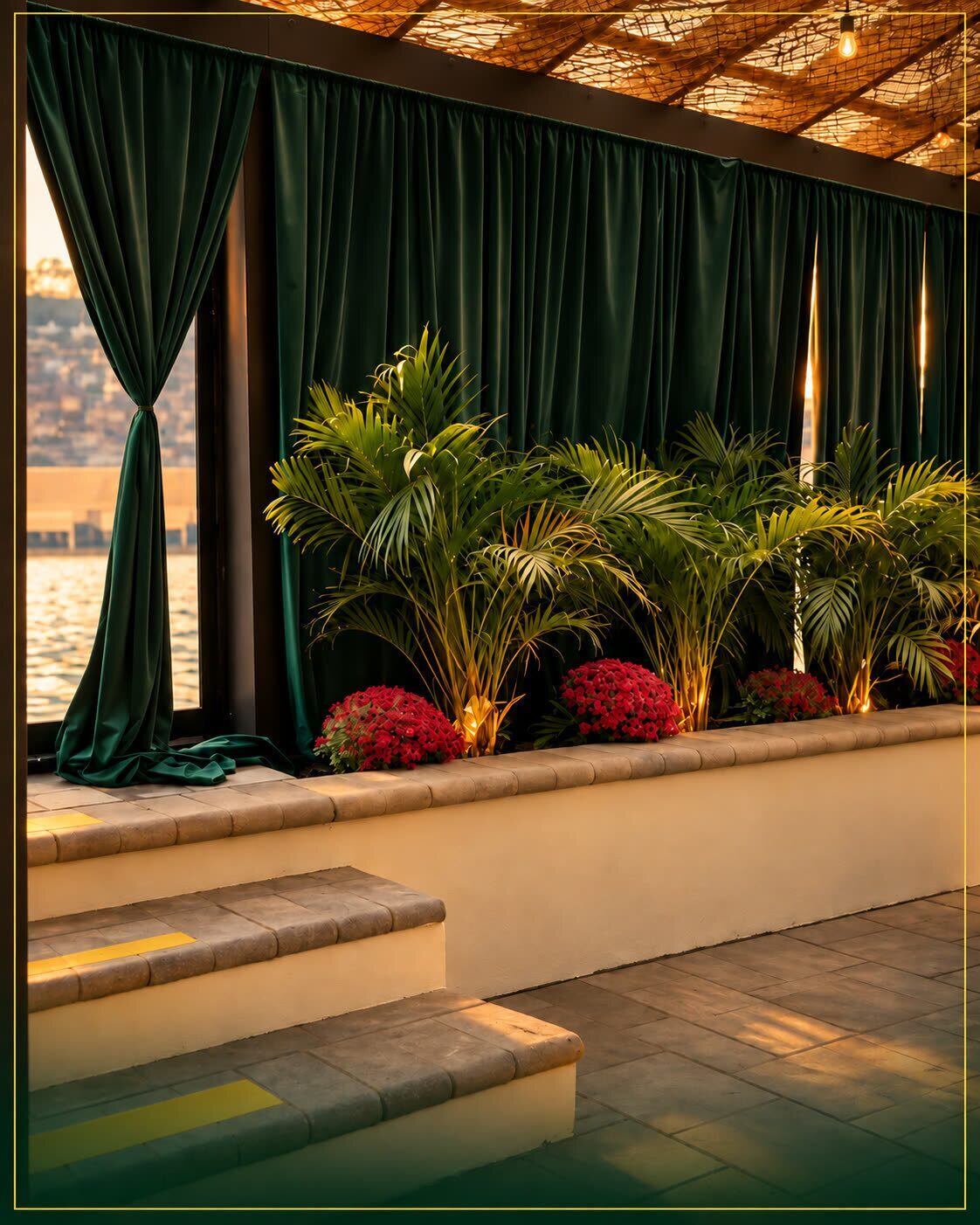 Emerald velvet curtains drawn back to the water, with palms and red flowers